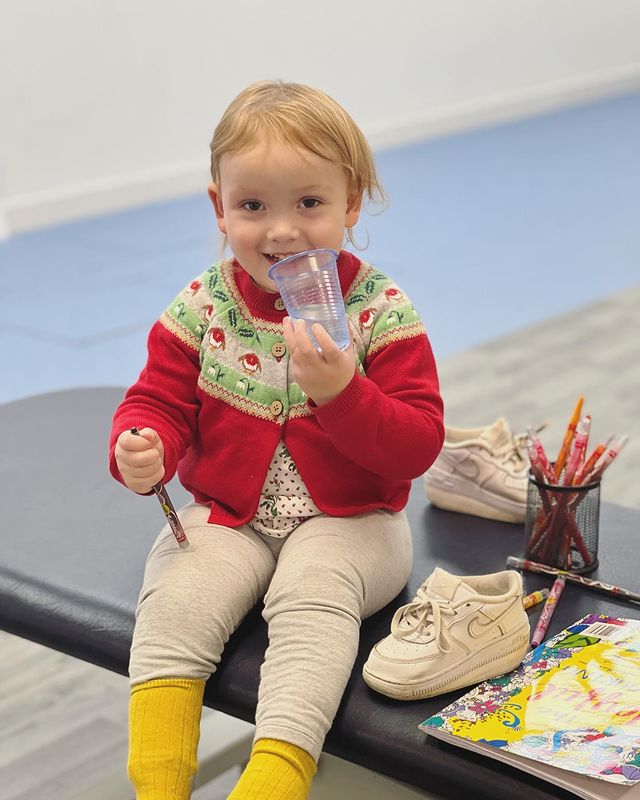 Flora, baby with spina bifida, getting ready for ankle foot orthosis fitting